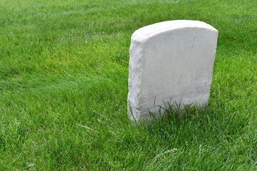 Unmarked grave. Small headstone, granite.