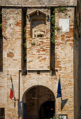 Aerial view of historic Scaliger Castle in Sirmione, Italy, surrounded by mountains