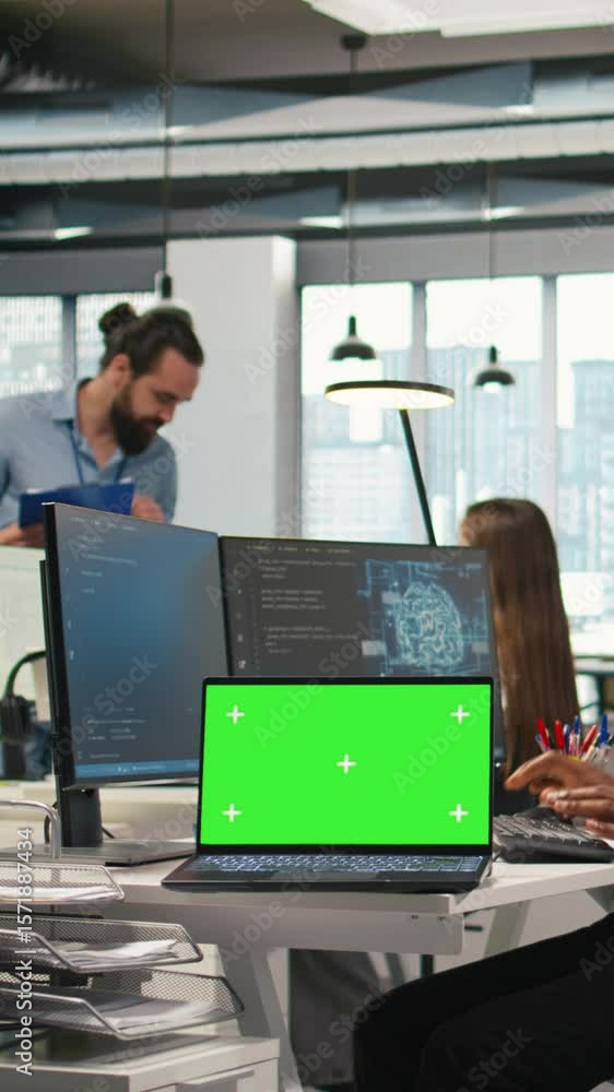 Poster vertical video startup office programmer using green screen laptop, developing artificial intelligen