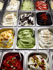 Display of various flavors of ice cream displayed in metal trays