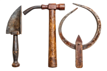Collection of three antique worn farm tools including a hammer sickle and hoe isolated on a transparent background