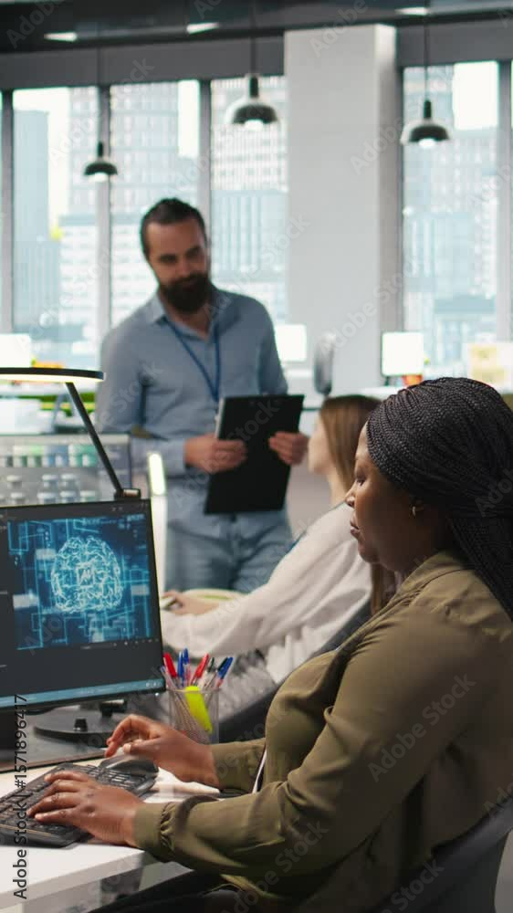 Poster vertical video computer scientist in startup office reviewing ai system metrics, monitoring performa