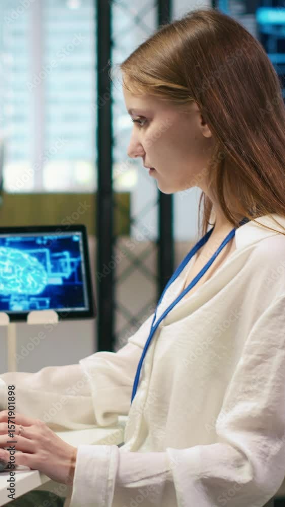 Poster vertical video junior dev in office relies on ai tech to run tasks across multiple devices, monitori