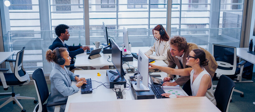A bustling office filled with professionals collaborating and innovating together