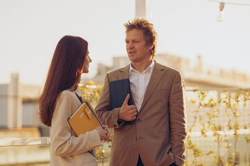 Professionals working in various businesses engage in meaningful discussions outdoors