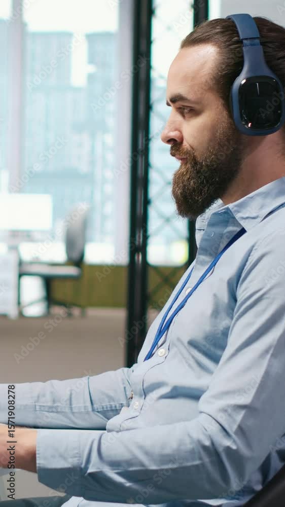 Poster vertical video software developer coding with ai language model assistance in office, listening musi