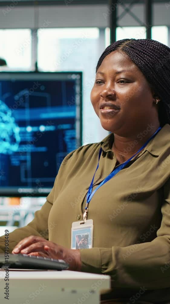 Poster vertical video female technician using computer to write code, developing machine learning apis. afr