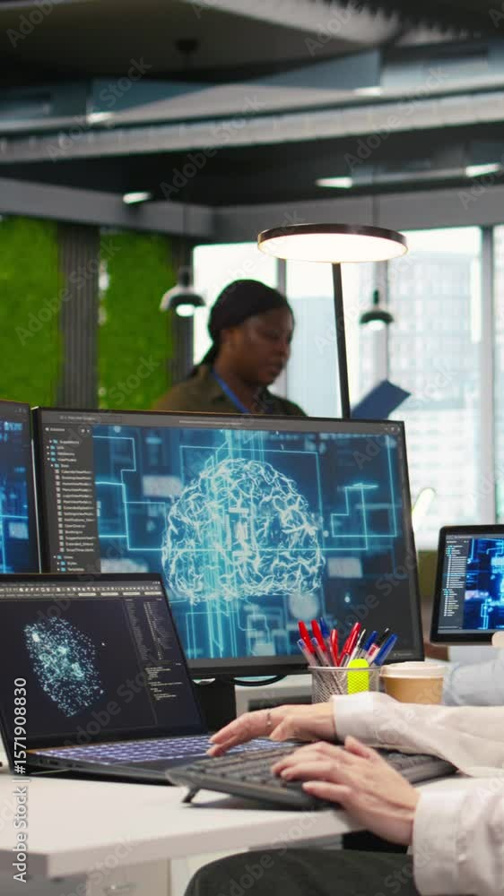 Poster vertical video it expert in high tech startup office uses neural networks to develop artificial inte