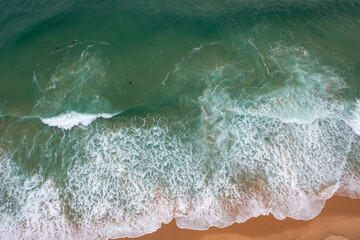 Aerial view of beautiful tropical beach and sea with sand and wave. Turquoise color water