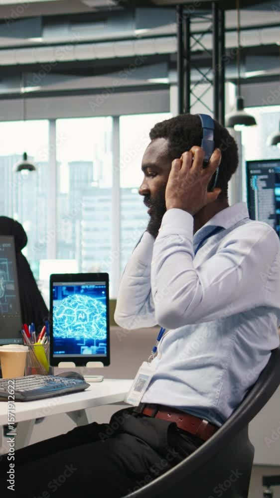Fototapete vertical video programmer in office relies on ai machine learning to automate repetitive tasks, look