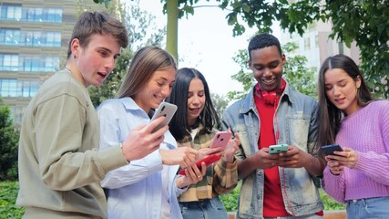 A group of enthusiastic teens enjoying their time together as they interact with their smartphones, exploring various applications and sharing exciting discoveries with each other in a lively - Powered by Adobe