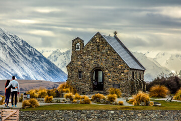 Unrecognisable lovers at the famous church of the good shepherd at Lake Tekapo