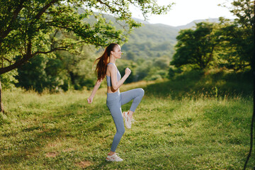 Young woman jogging in a green meadow, showcasing healthy lifestyle and fitness Emphasizing...