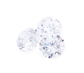 Many beautiful shiny diamonds on white background