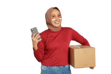 Excited young Asian women celebrate Indonesian independence day on 17 August while holding cardboard boxes and smartphone isolated on transparent background