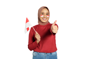 Happy young Asian women celebrate Indonesian independence day on 17 August by holding the Indonesian flag and gesturing thumbs up isolated on transparent background