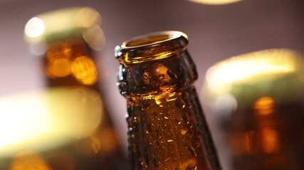 Opening bottle of beer on blurred background, closeup - Powered by Adobe
