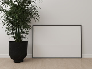 Horizontal frame mockup on the floor with a white wall and an ornamental plant. 3D rendering,...