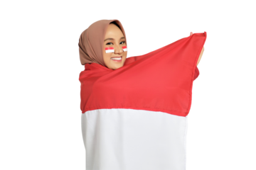 Happy young Asian women celebrate Indonesian independence day on 17 August with the Indonesian flag isolated on transparent background