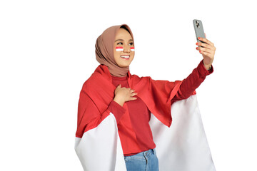 Happy young Asian women celebrate Indonesian independence day on 17 August doing selfie shot on...