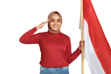 Young Asian women celebrate Indonesian independence day on 17 August, saluting and holding Indonesian flag isolated on transparent background