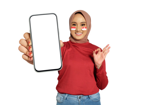 Smiling young Asian women celebrate Indonesian independence day on 17 August while holding smartphone with blank screen and showing ok sign isolated on transparent background