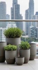 Urban Balcony Garden: Lush Green Plants in Modern Gray Pots with City Backdrop