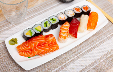 Set of different sushi maki, nigiri and sashimi closeup