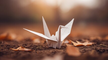 A delicate paper crane resting on autumn leaves, symbolizing peace with minimalist and warm-toned elegance.
