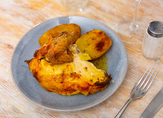 Delicious roasted chicken thigh served with boiled potatoes