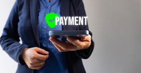 A businesswoman shows her cell phone while a button with the word 
