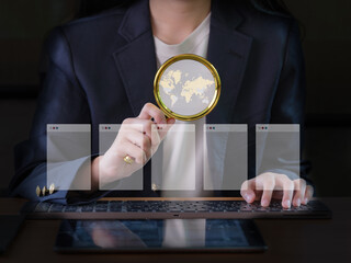 Close-Up Image of a Businesswoman's Hand Using a Magnifying Glass on a Miniature World.