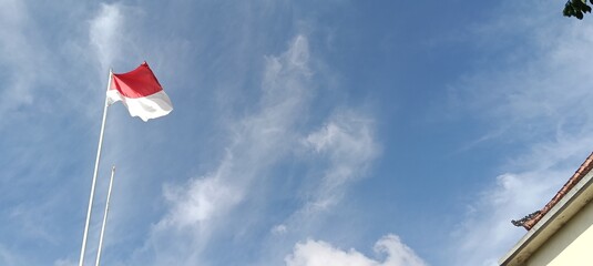 american flag against blue sky