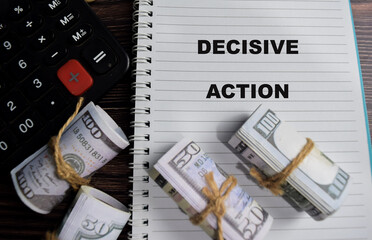 Concept of decisive action write on book isolated on Wooden Table.