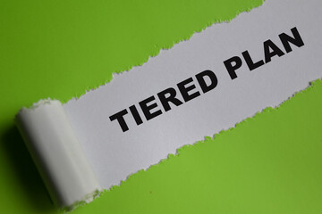 The tiered plan Text written in torn paper