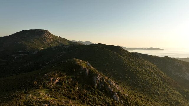 Sunset Light on Corsican Ridges Above the Mediterranean Sea