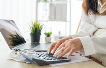Human use calculator and calculate bills and paying bill, credit card, tax and vat, payment,...