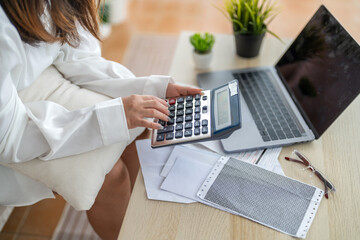 Human use calculator and calculate bills and paying bill, credit card, tax and vat, payment,...