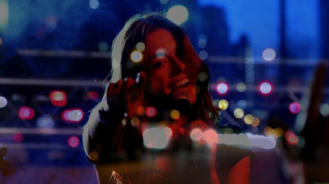Silhouette singer stepping forward, taking mic and singing and pointing at camera with city lights
