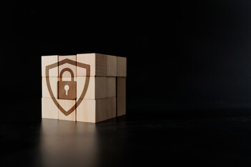 Wooden Block Cube with Lock Icon for Security Concept