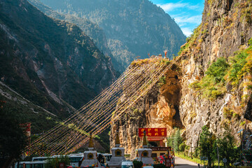 Prayer Flags Crossing a Deep Balagezong Canyon in Shangri-La