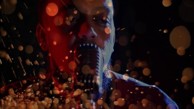 As glowing orange particles swirling, male singer leaning into microphone, singing line for music