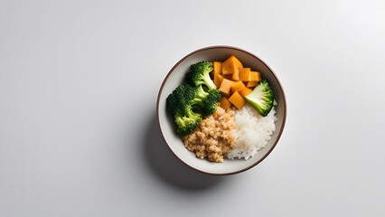 Flat lay of balanced vegetarian tofu bowl with broccoli and rice on minimalist background