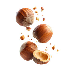 Three Falling Hazelnuts With Shell Pieces on Dark Transparent Background