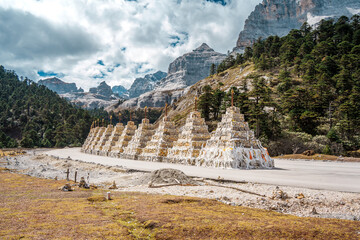 Row of White Shambhala Pagodas in a Himalayan Mountain Valley