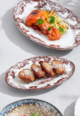 Baked potatoes with parmesan, bright daylight, minimal overhead composition
