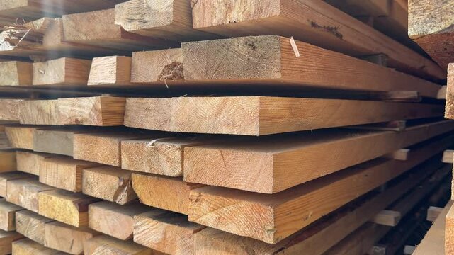ends of the wooden pine edged planks in the warehouse close-up