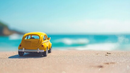 Fototapeta premium A yellow toy car on a sandy beach with the ocean in the background.