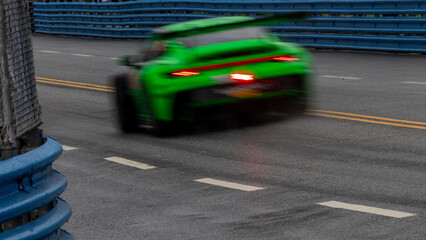 Motion blur race car racing on speed track, Motion blurred super car race on street track circuit,...