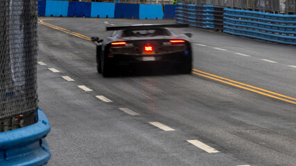 Motion blur race car racing on speed track, Motion blurred super car race on street track circuit,...